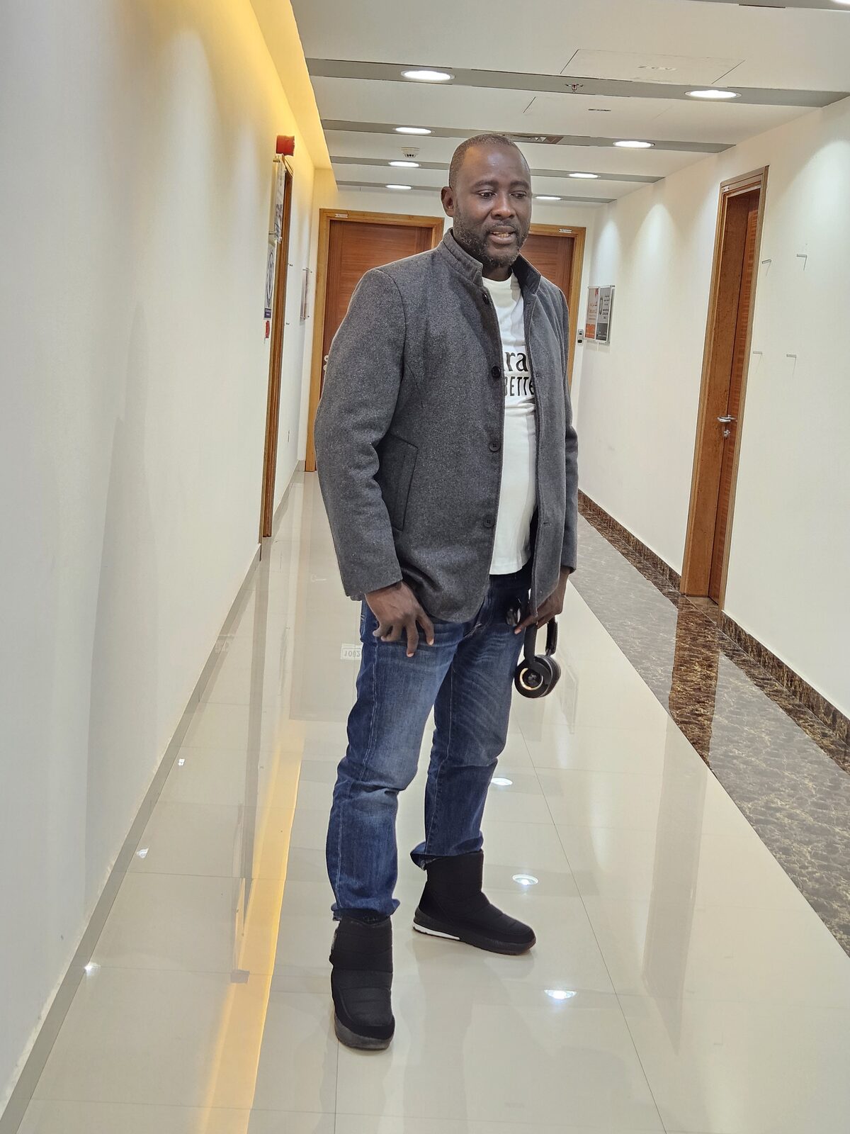 Austin Obule Emovworho in a grey blazer, a smart professional portrait