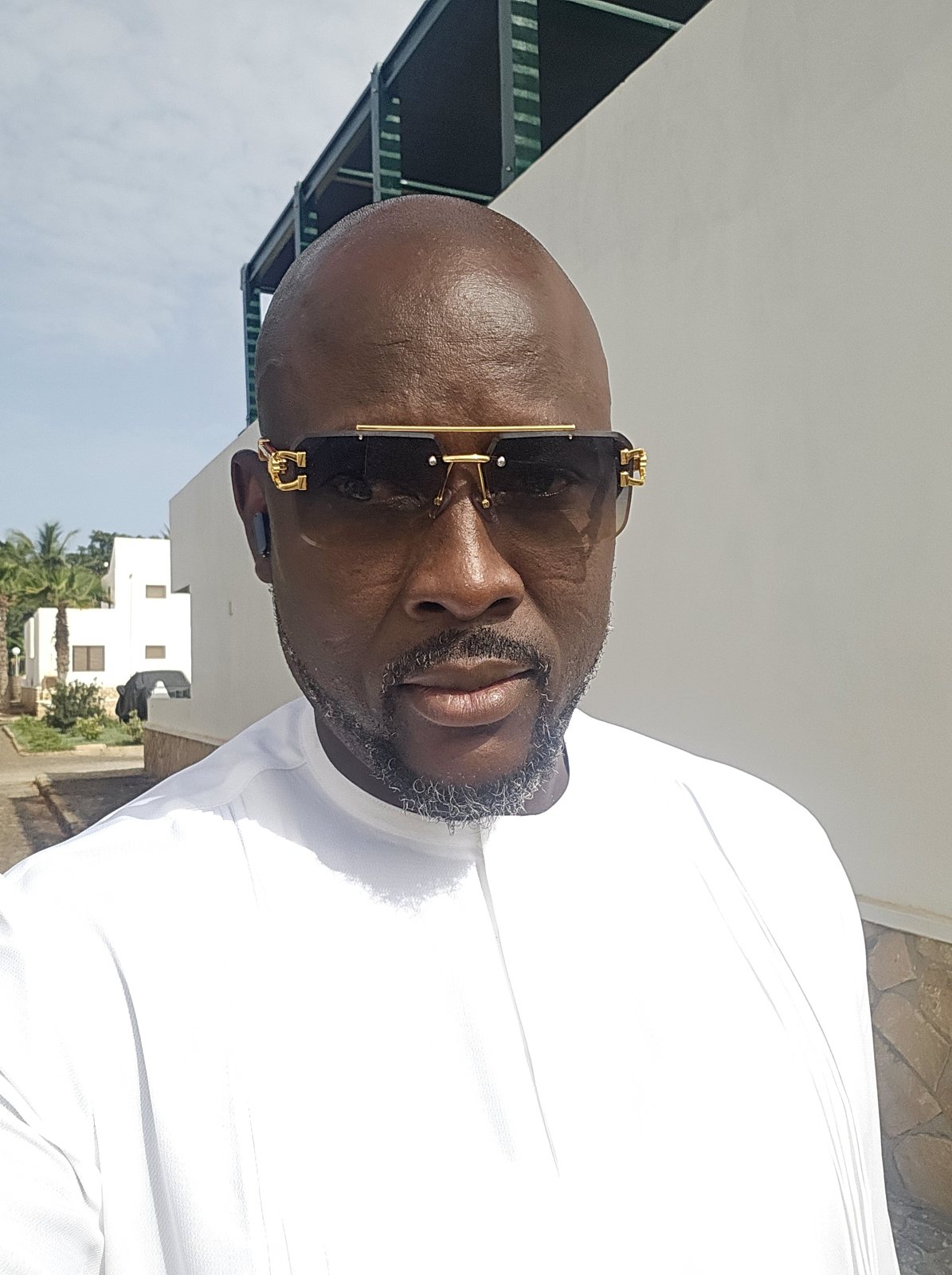Austin Obule Emovworho in elegant white attire